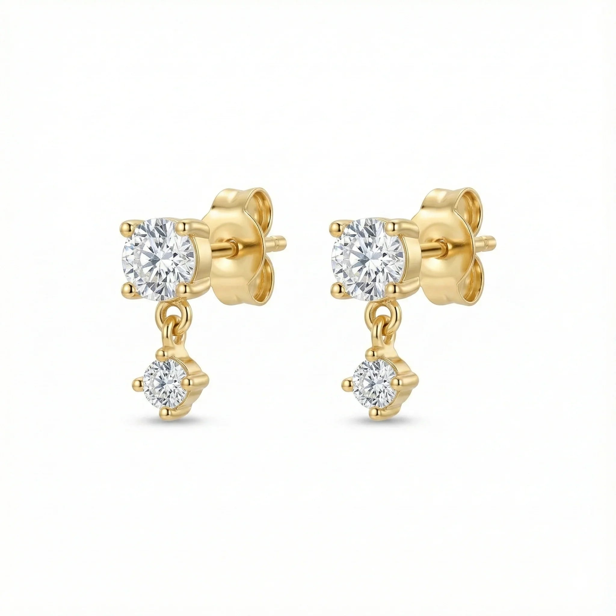 Puces d'oreilles dorées composées d'un solitaire rond et d'un second zirconium plus petit suspendu et mobile